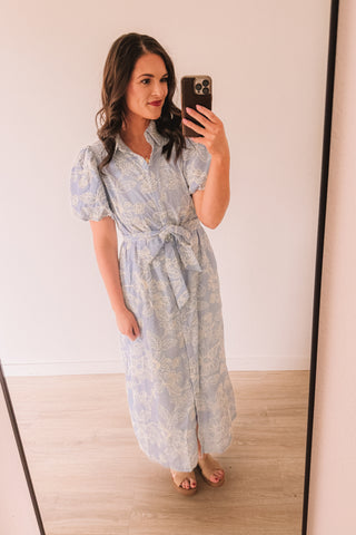 


This elegant midi dress features a refined blue stripe base elevated ...
