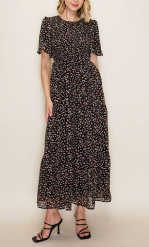 Timeless and romantic, this black floral midi dress features a delicate ...