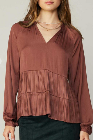 100% Polyester 
Fits true to size. Model is wearing a size Small. 