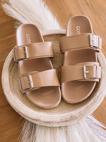 Double buckle details + the prettiest neutral double strap sandal. 
Fits...